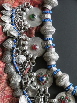 Close up old beads and coin dangles