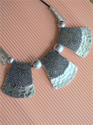 Close up of Antiqued Hammered Pendants